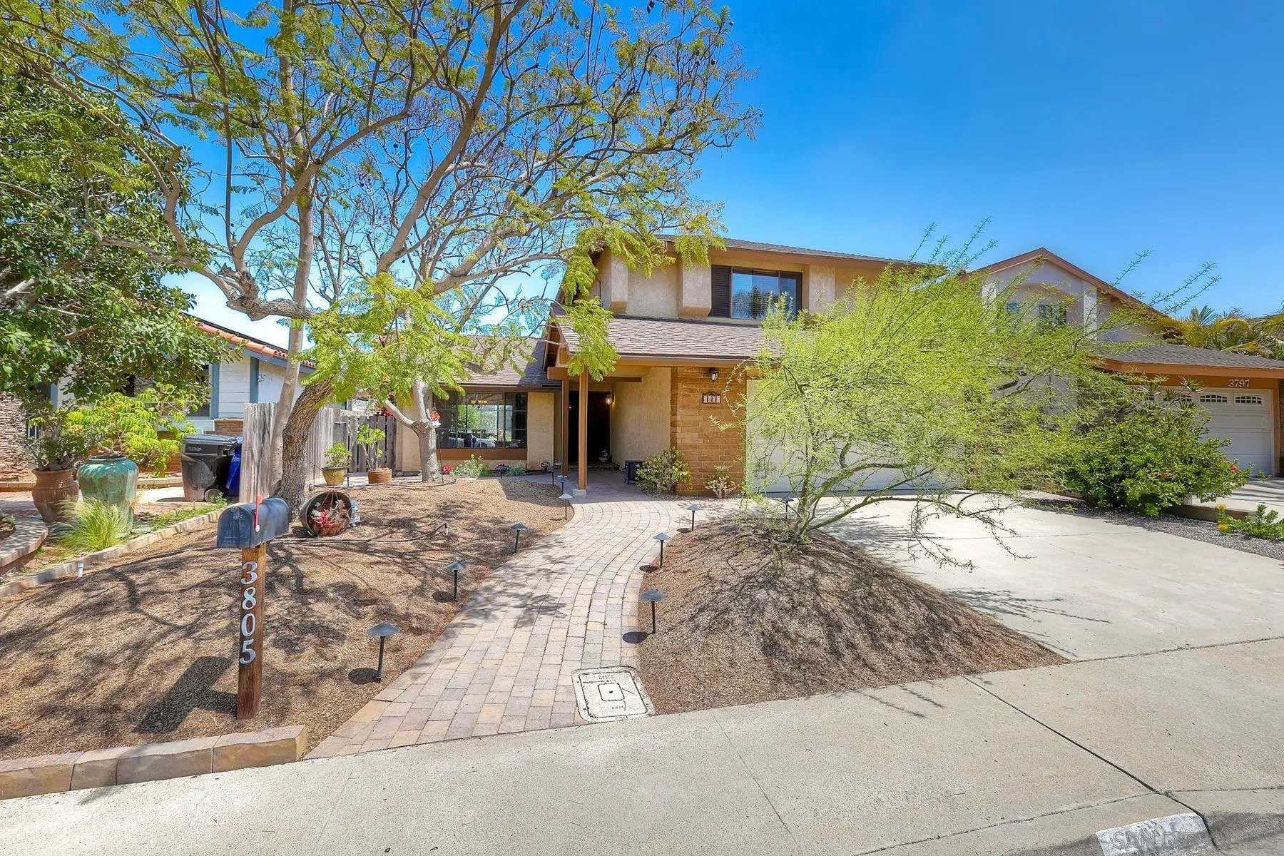 3805 Catamarca Drive San Diego, CA 92124 - Photo 55 of 59 a front view of a house with a yard and garage