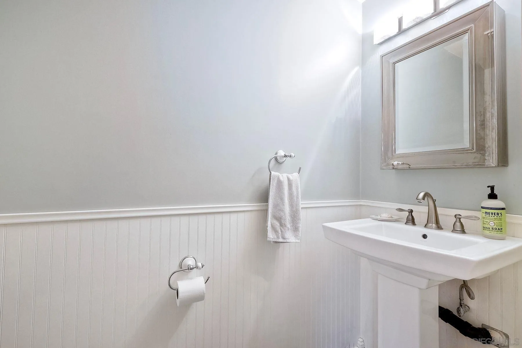 3805 Catamarca Drive San Diego, CA 92124 - Photo 57 of 59 a bathroom with a sink and a mirror