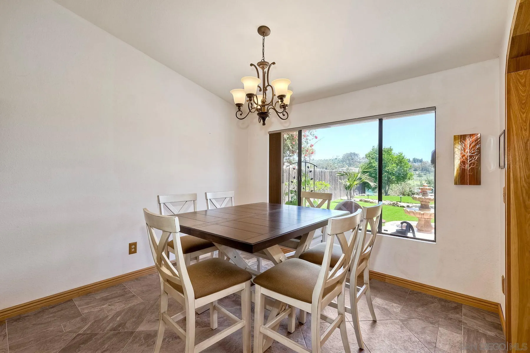 3805 Catamarca Drive San Diego, CA 92124 - Photo 8 of 59 a dining room with furniture a chandelier and wooden floor