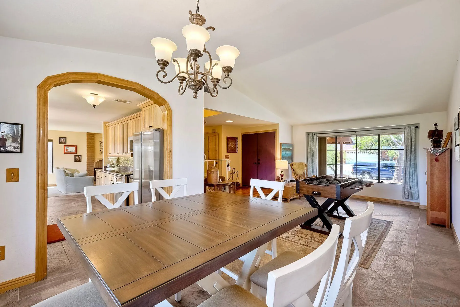 3805 Catamarca Drive San Diego, CA 92124 - Photo 9 of 59 a view of a dining room with furniture wooden floor and chandelier