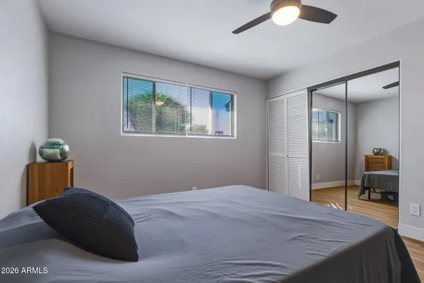 a bedroom with a bed and a dresser