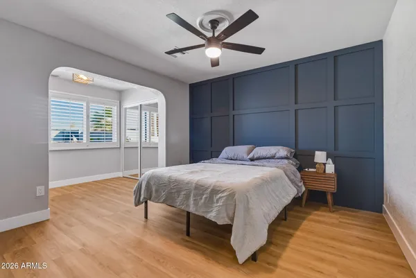 a bedroom with a bed and window