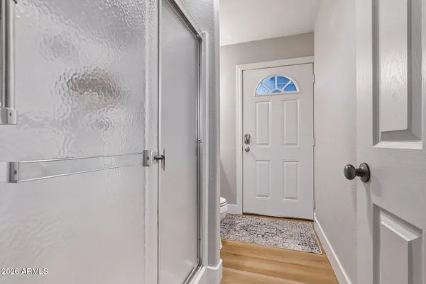 a view of front door with a rug