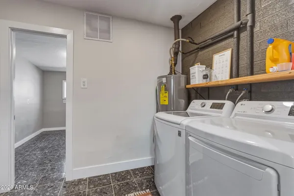 a utility room with dryer and washer