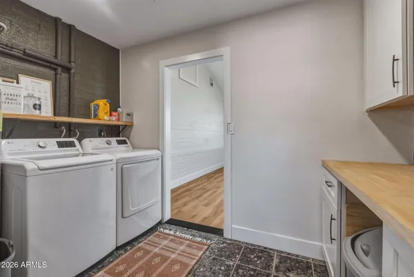a utility room with dryer and washer