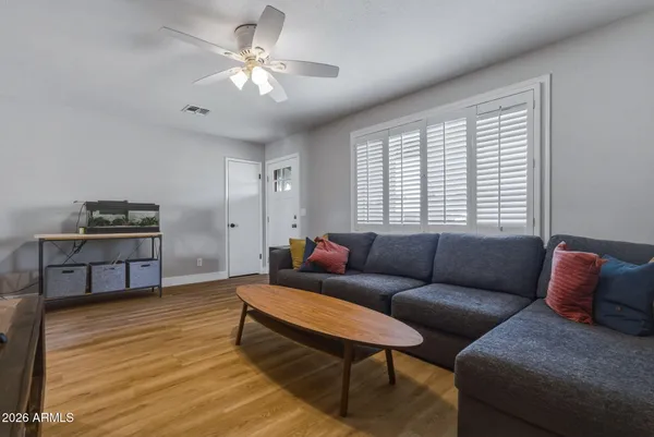 a living room with furniture and a window