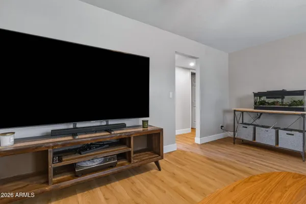 a room with furniture and flat screen tv