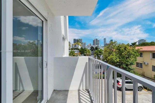 a view of a balcony with wooden fence and floor