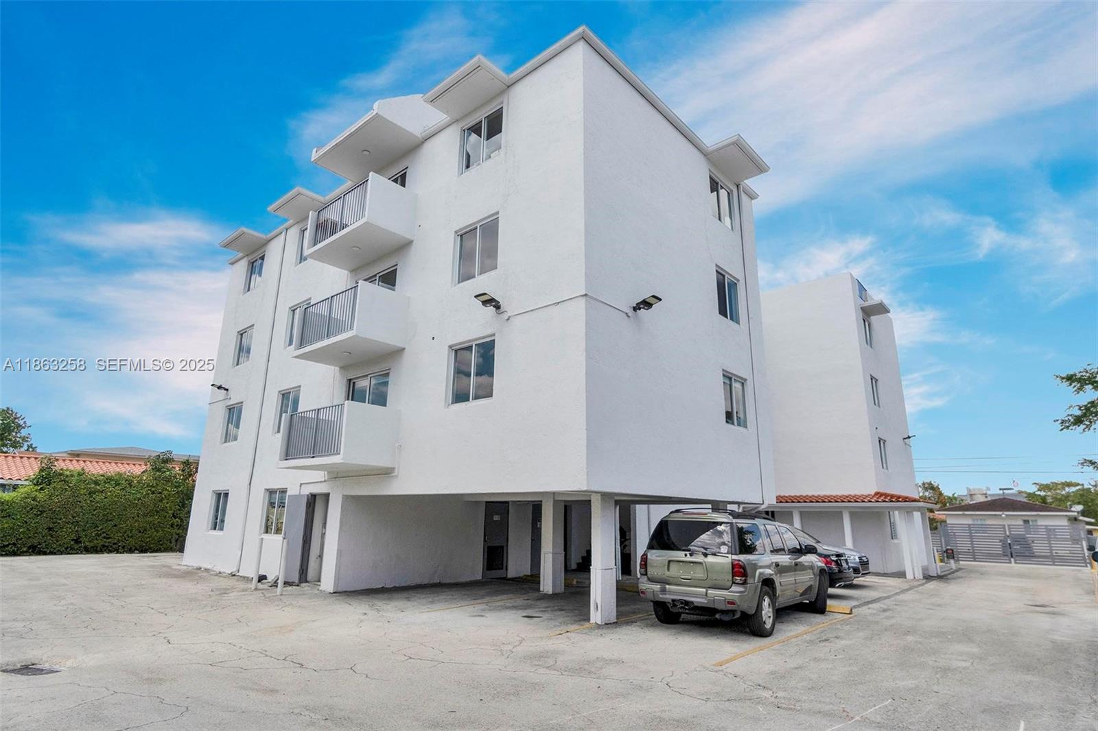 620 Southwest 10th Street, Unit 405 Miami, FL 33130 - Photo 13 of 21 a car parked in front of white building
