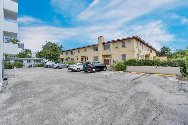 a view of car parked in front of house