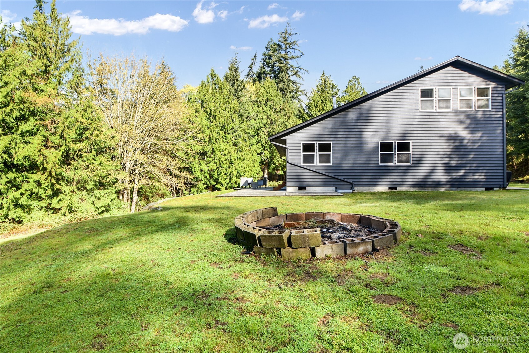 2101 Wagner Road Camano Island, WA 98282 - Photo 28 of 36 a view of a house with a yard