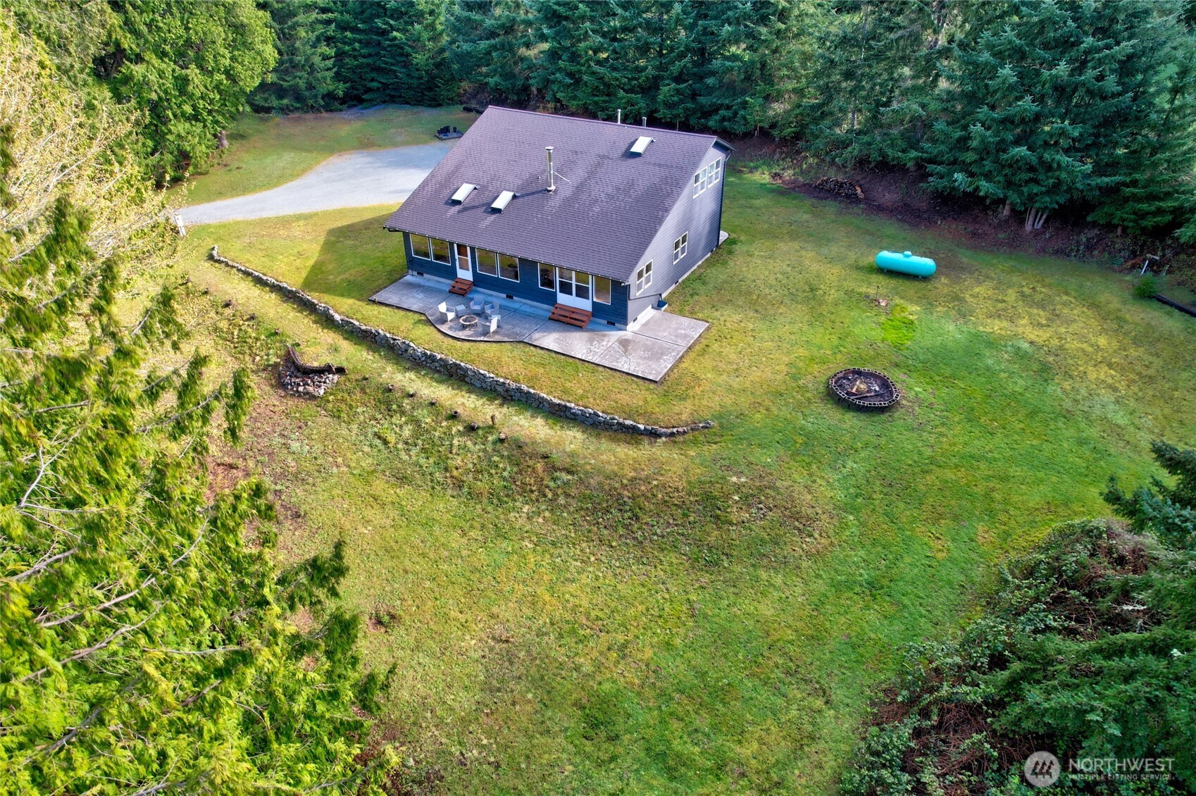 2101 Wagner Road Camano Island, WA 98282 - Photo 30 of 36 a view of a house with a yard