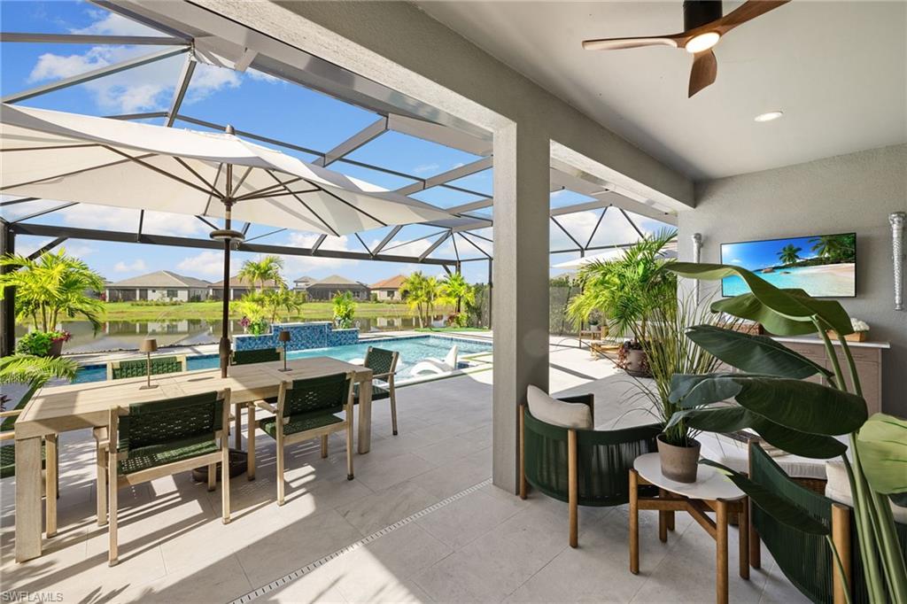 3967 Pegasus Way Naples, FL 34120 - Photo 23 of 50 a room with lots of tables and chairs