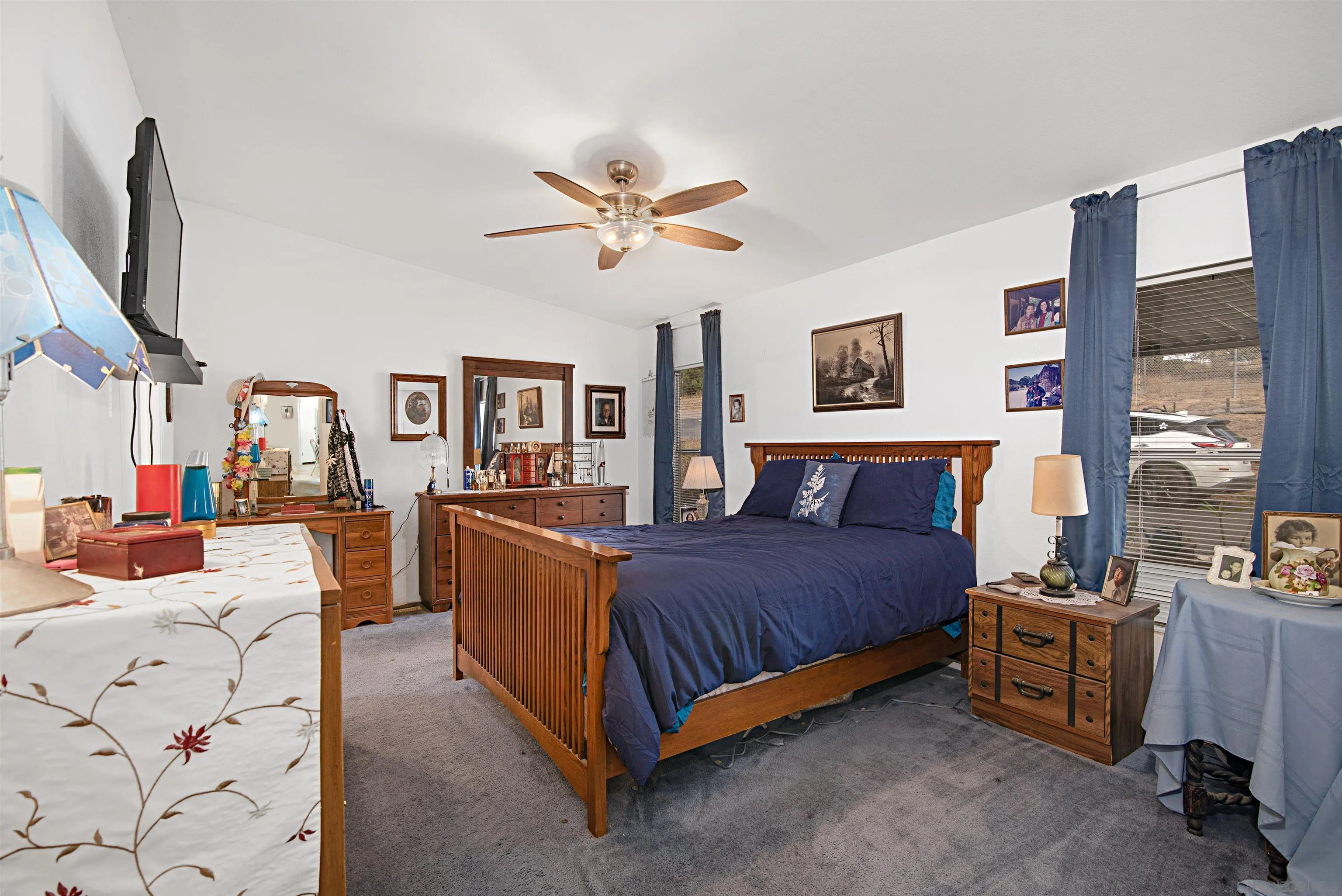 2030 Black Canyon Road, Unit 29 Ramona, CA 92065 - Photo 15 of 35 a bed room with a bed and a chandelier