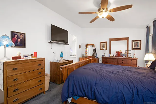 a bed room with bed and a flat screen tv