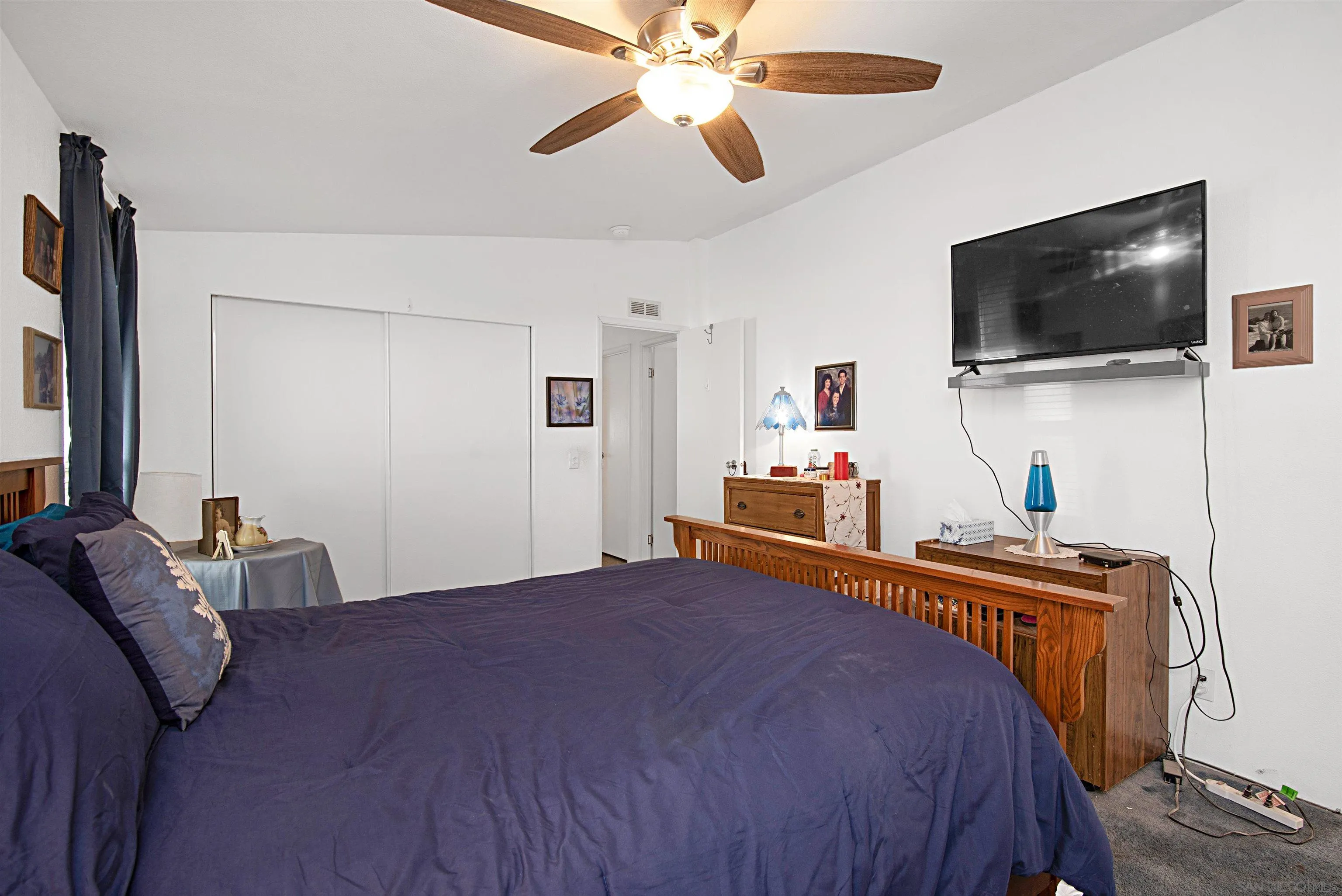 2030 Black Canyon Road, Unit 29 Ramona, CA 92065 - Photo 18 of 35 a bedroom with a bed and a flat screen tv