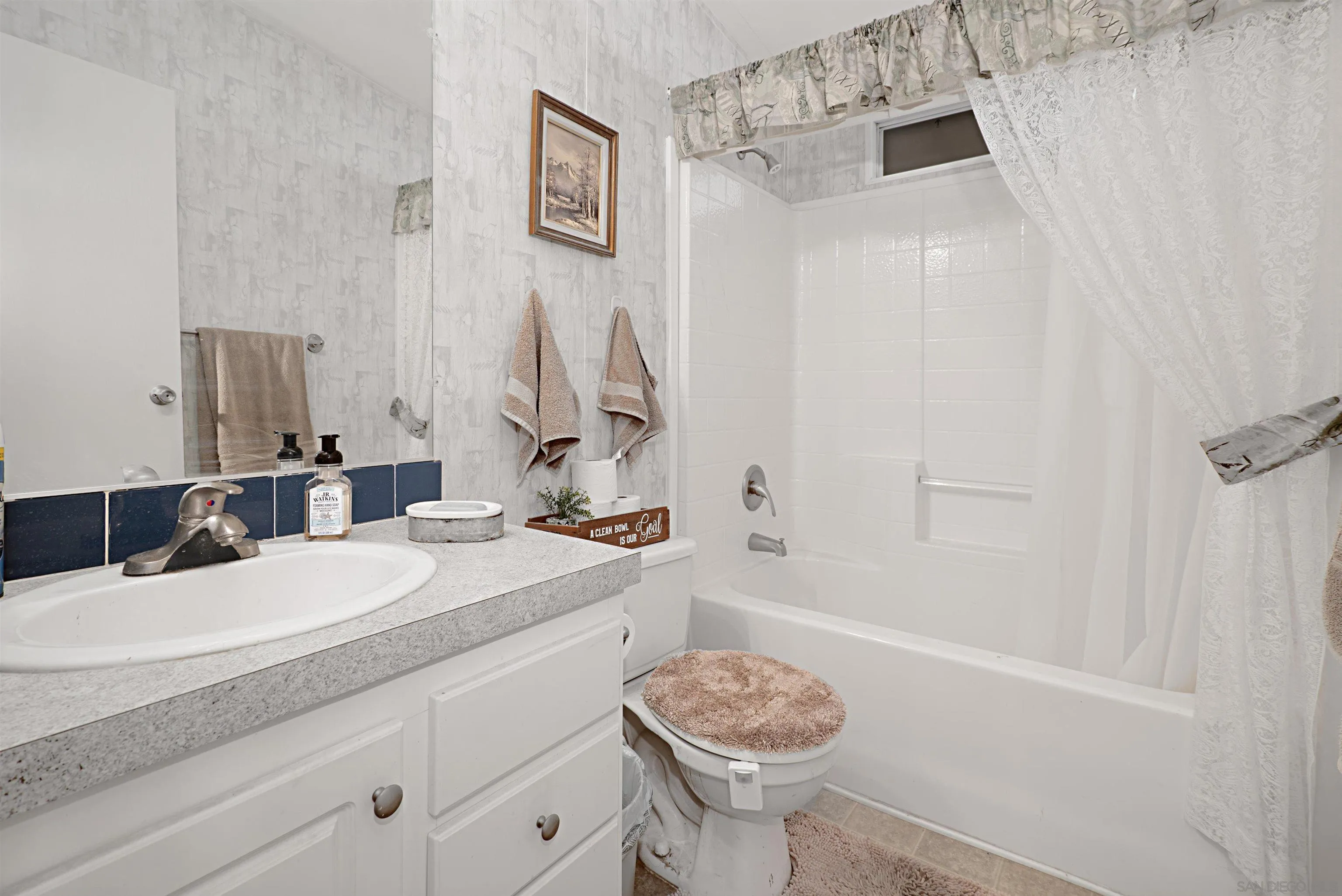 2030 Black Canyon Road, Unit 29 Ramona, CA 92065 - Photo 24 of 35 a bathroom with a sink a toilet and shower