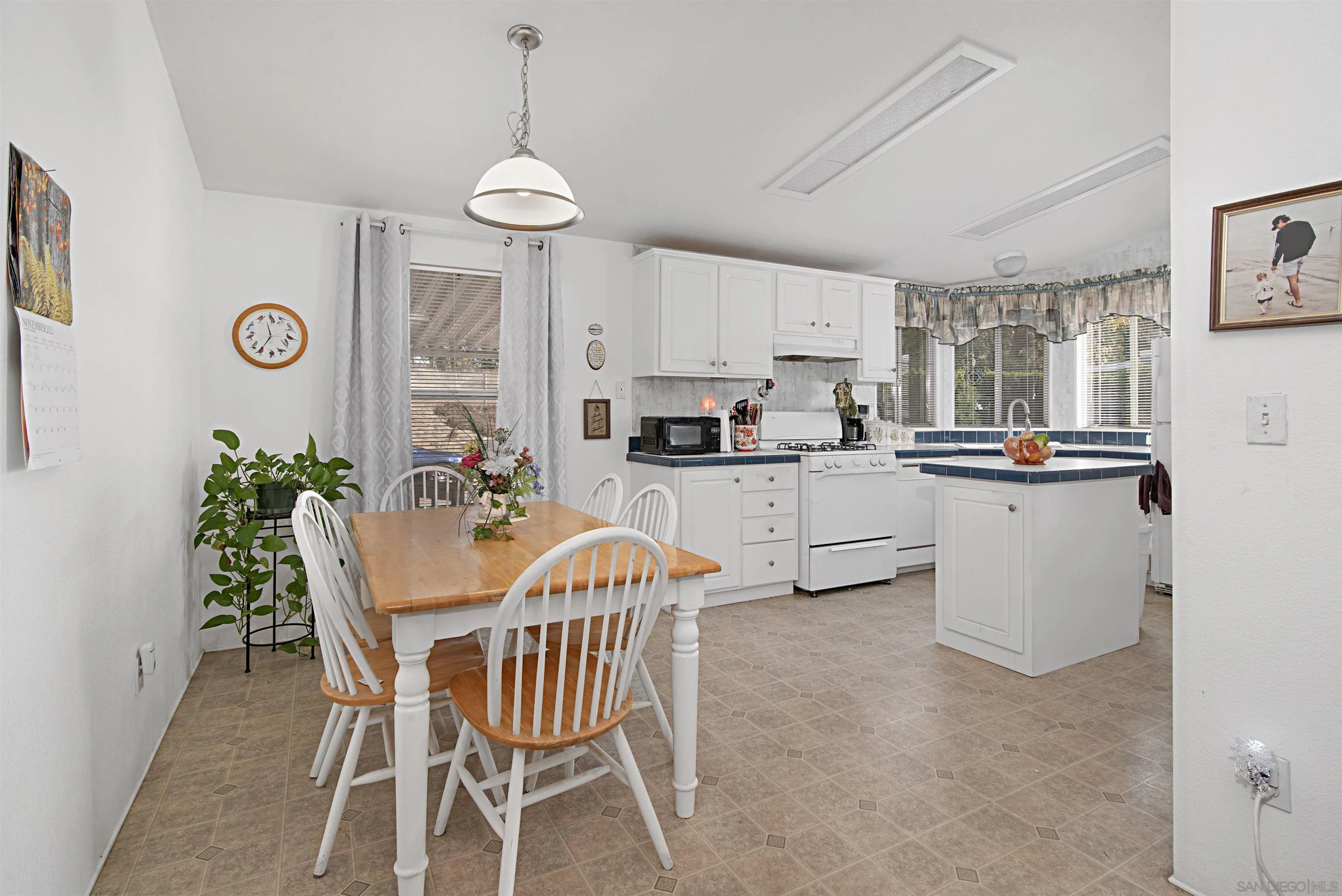 2030 Black Canyon Road, Unit 29 Ramona, CA 92065 - Photo 5 of 35 a view of a dining room with furniture window and wooden floor