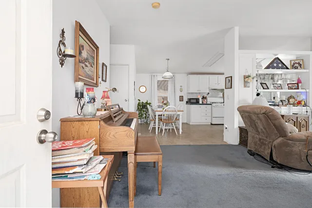 a living room with furniture and a table