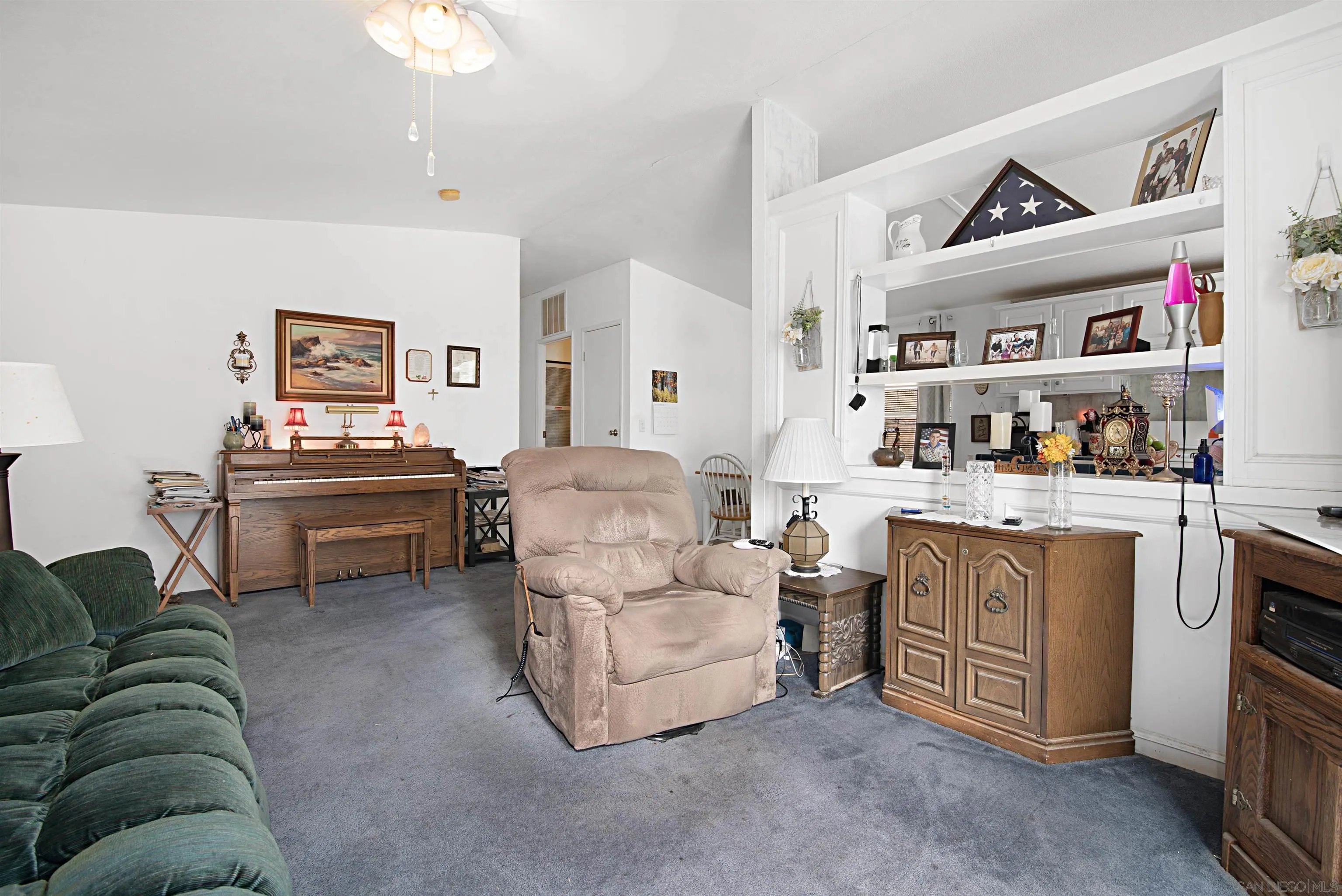 2030 Black Canyon Road, Unit 29 Ramona, CA 92065 - Photo 8 of 35 a living room with furniture and painting on the wall