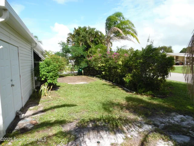 a view of backyard with green space