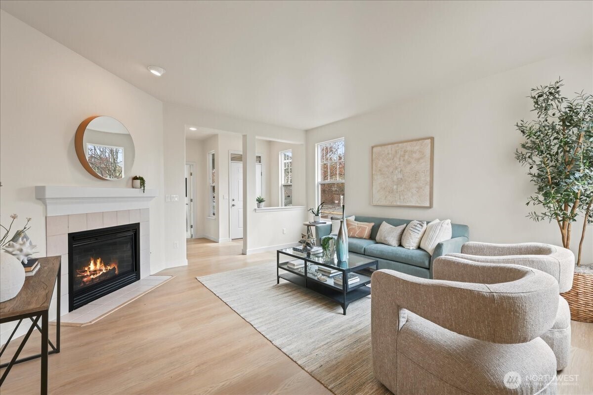 401 Graham Avenue Northeast Renton, WA 98059 - Photo 17 of 40 a living room with furniture and a fireplace