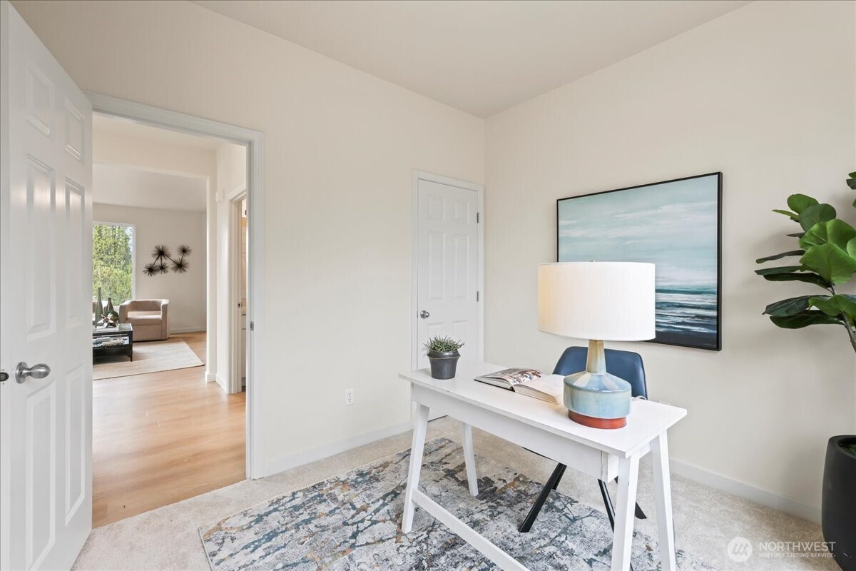 401 Graham Avenue Northeast Renton, WA 98059 - Photo 20 of 40 a view of a workspace with furniture and a bedroom