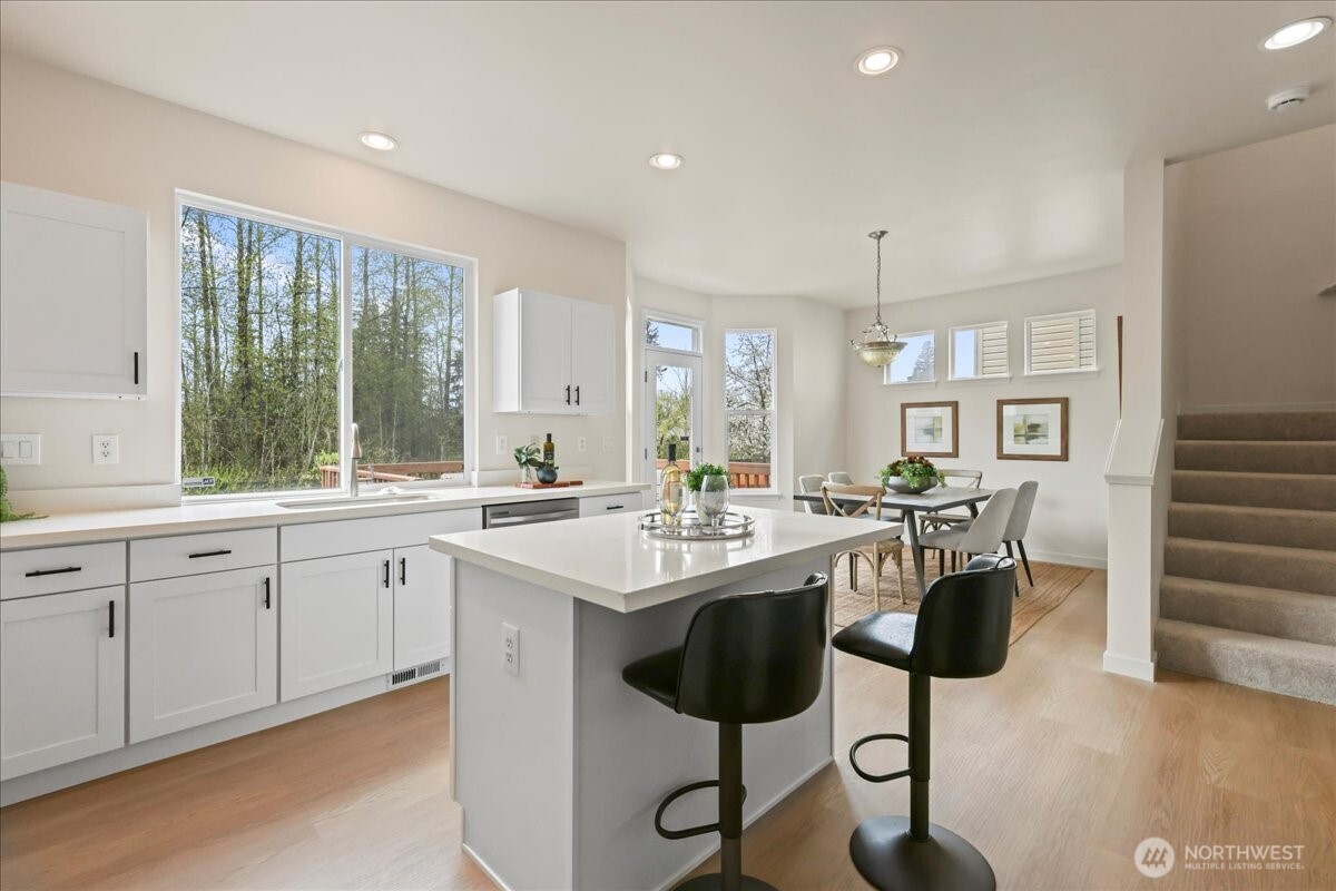 401 Graham Avenue Northeast Renton, WA 98059 - Photo 31 of 40 a kitchen with counter top space and sink