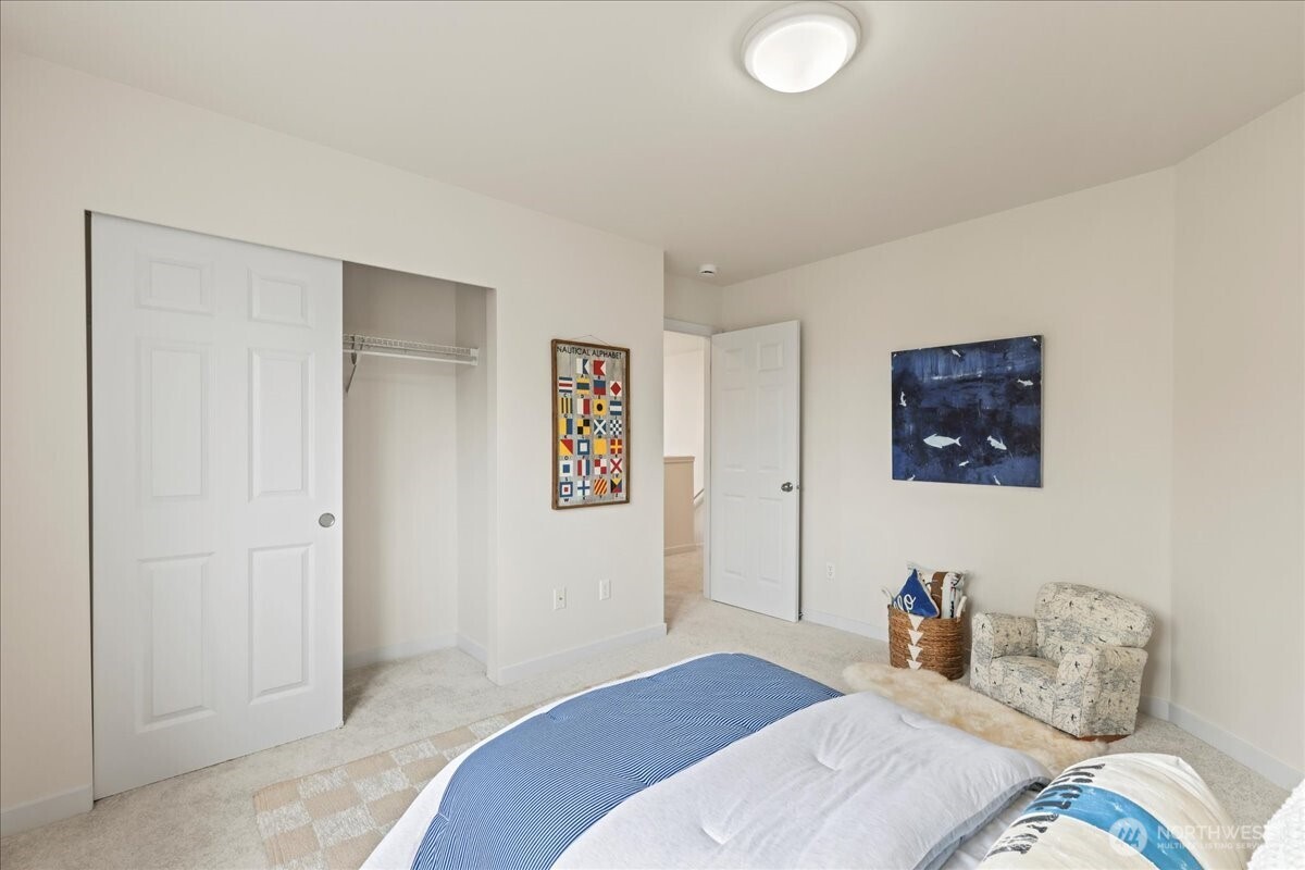 401 Graham Avenue Northeast Renton, WA 98059 - Photo 32 of 40 a bedroom with a bed and a couch