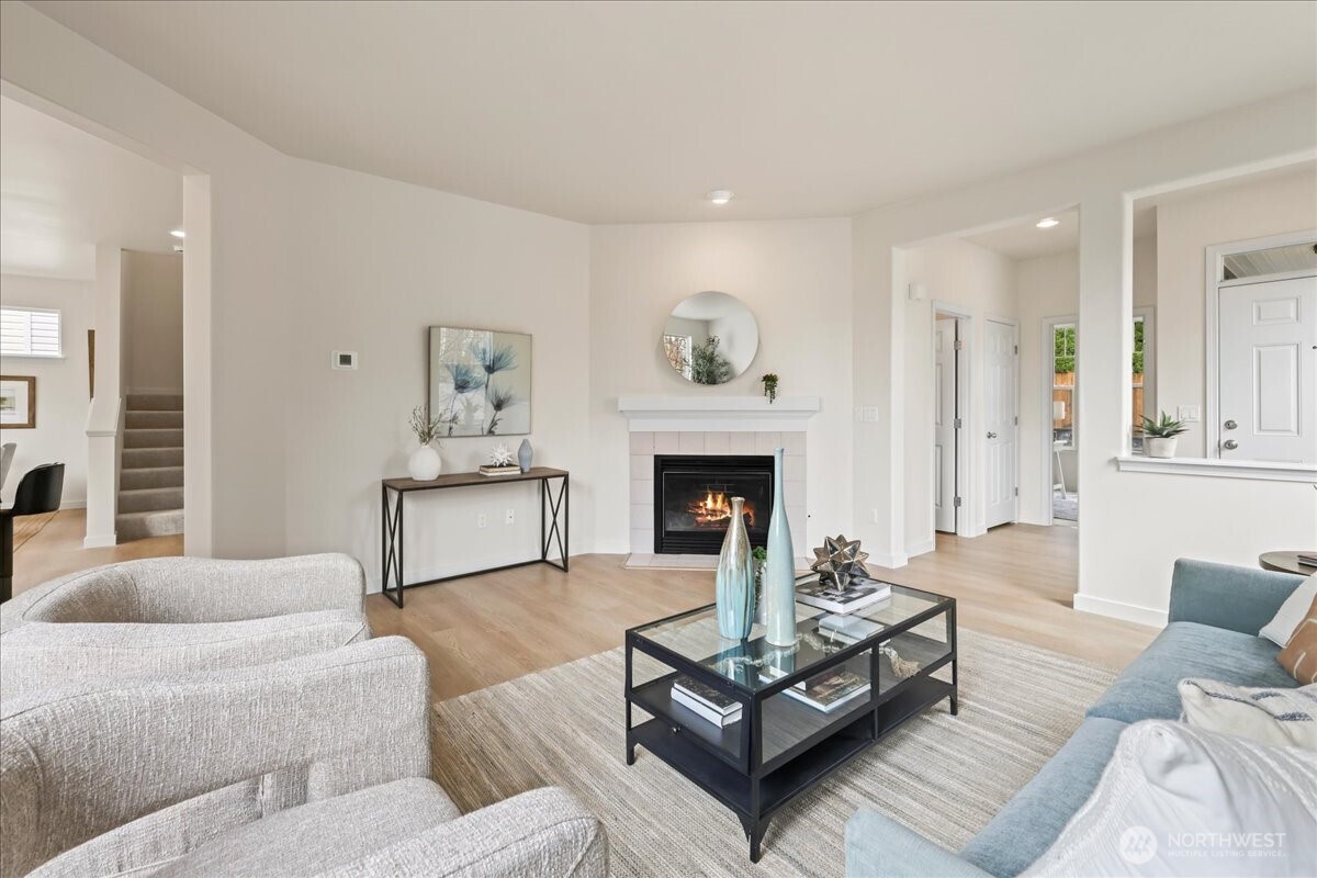 401 Graham Avenue Northeast Renton, WA 98059 - Photo 33 of 40 a living room with furniture and a fireplace