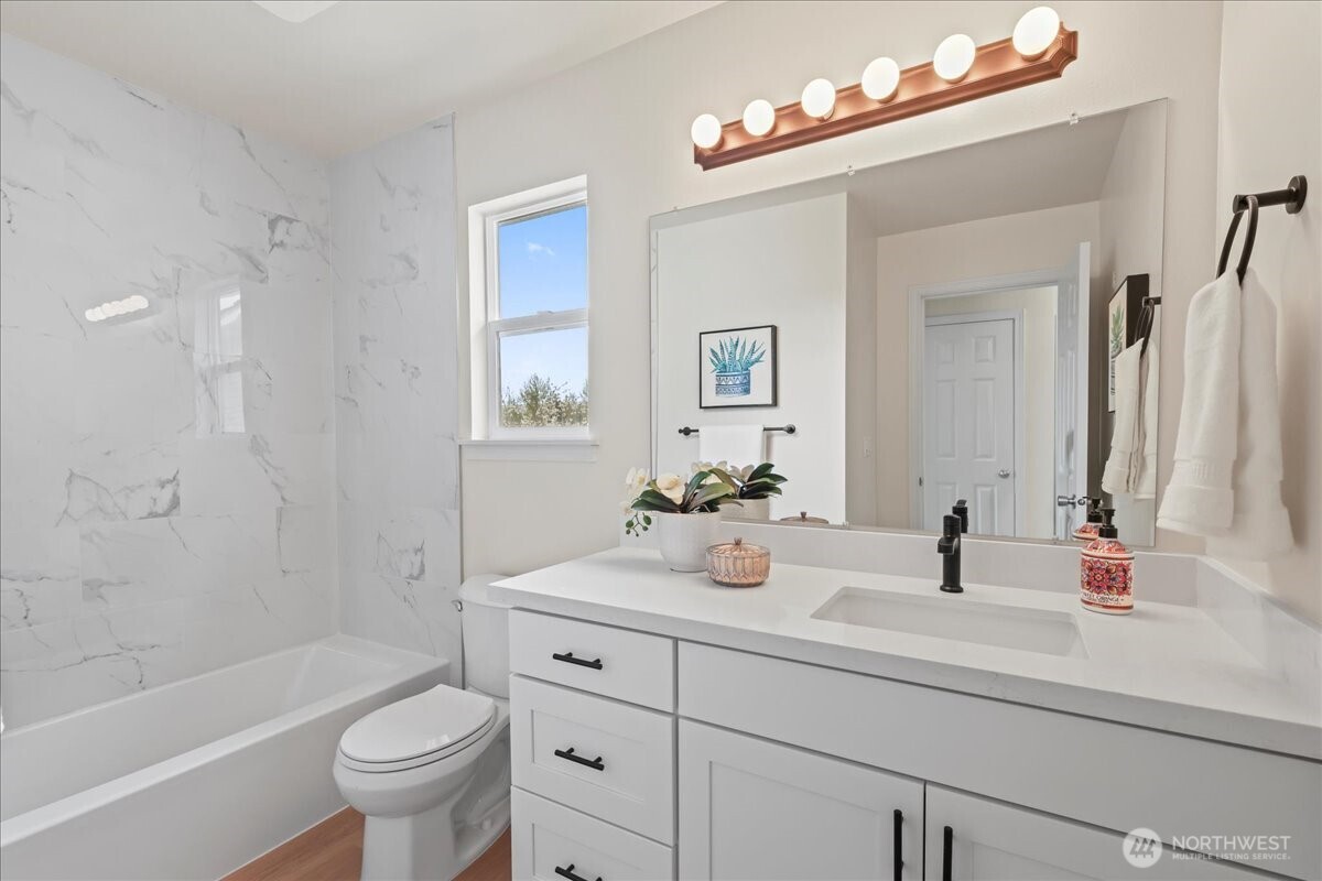 401 Graham Avenue Northeast Renton, WA 98059 - Photo 36 of 40 a bathroom with a sink a toilet and a bathtub