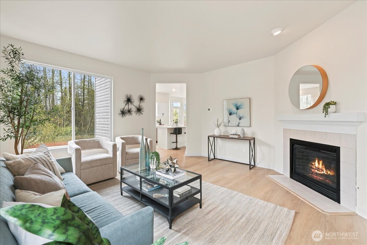 401 Graham Avenue Northeast Renton, WA 98059 - Photo 6 of 40 a living room with furniture and a fireplace