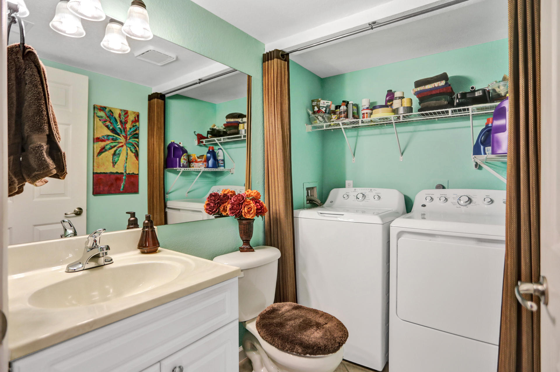 8057 Severn Drive, Unit A Boca Raton, FL 33433 - Photo 11 of 33 a bathroom with a sink mirror and toilet