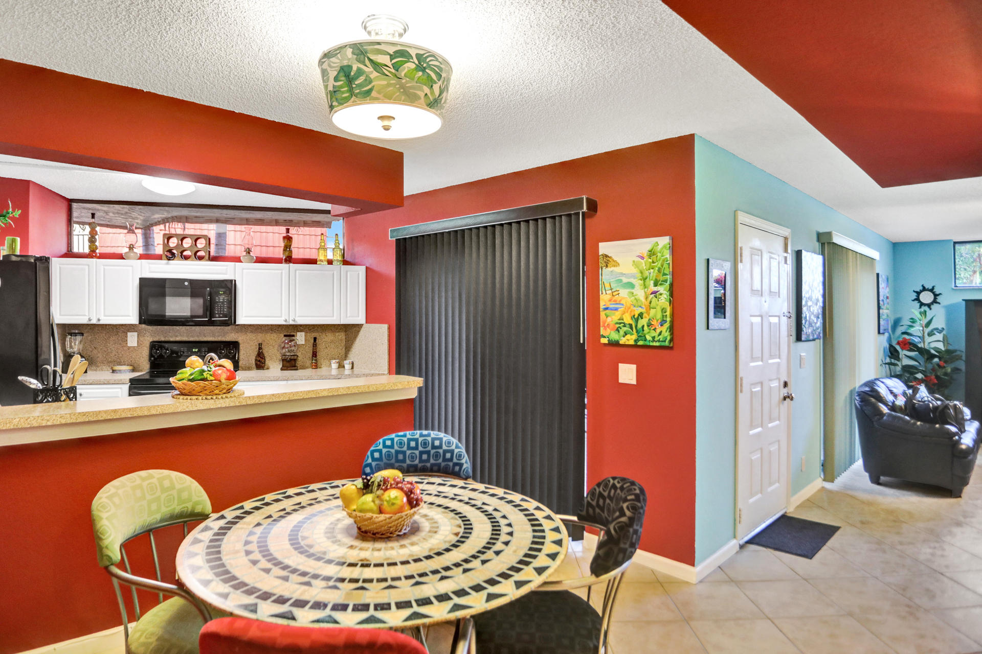 8057 Severn Drive, Unit A Boca Raton, FL 33433 - Photo 13 of 33 a kitchen with stainless steel appliances granite countertop a refrigerator and a chair