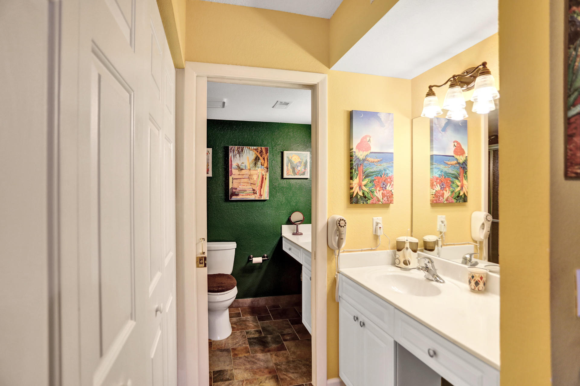 8057 Severn Drive, Unit A Boca Raton, FL 33433 - Photo 20 of 33 a en suite bathroom with a sink mirror and a shower