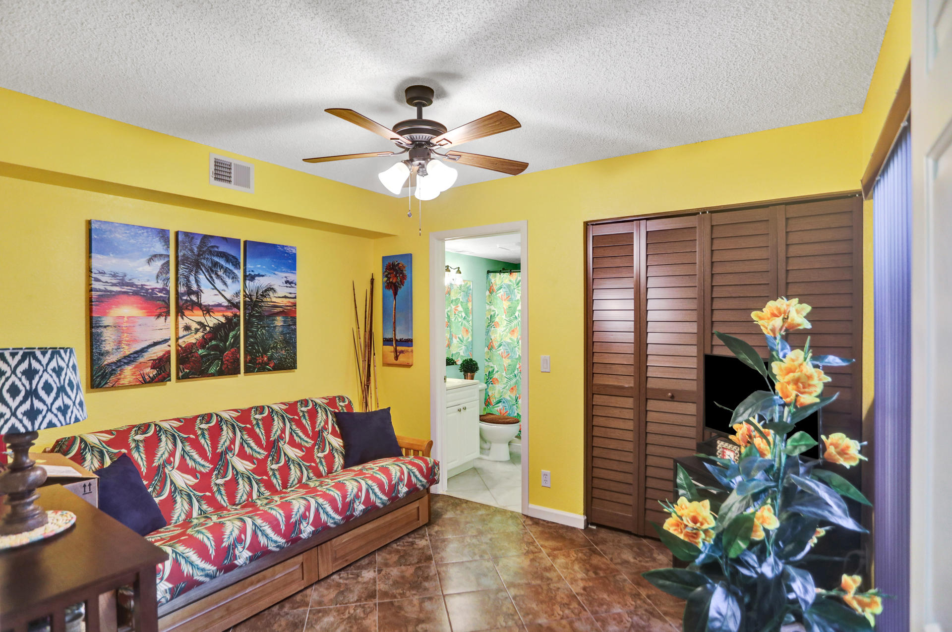 8057 Severn Drive, Unit A Boca Raton, FL 33433 - Photo 22 of 33 a bedroom with a bed and a painting on the wall