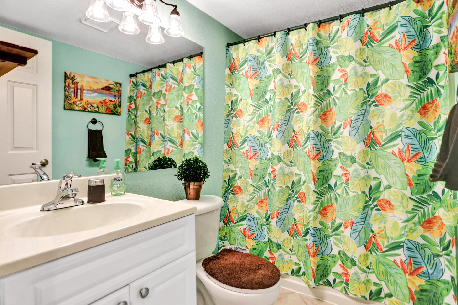 8057 Severn Drive, Unit A Boca Raton, FL 33433 - Photo 24 of 33 a bathroom with a sink a toilet and a mirror