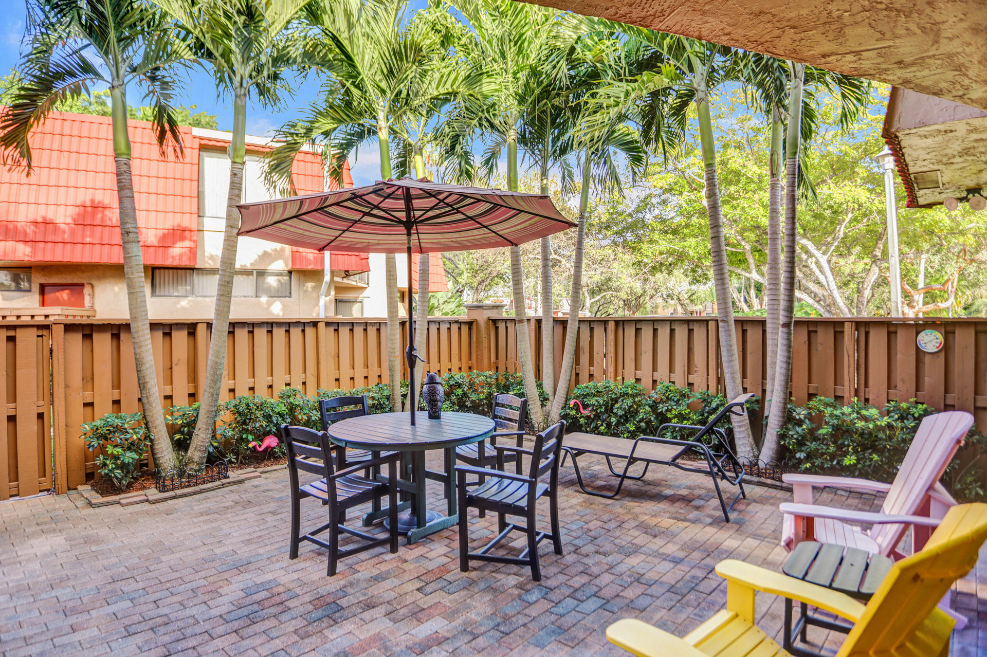 8057 Severn Drive, Unit A Boca Raton, FL 33433 - Photo 28 of 33 a view of a chairs and table in patio