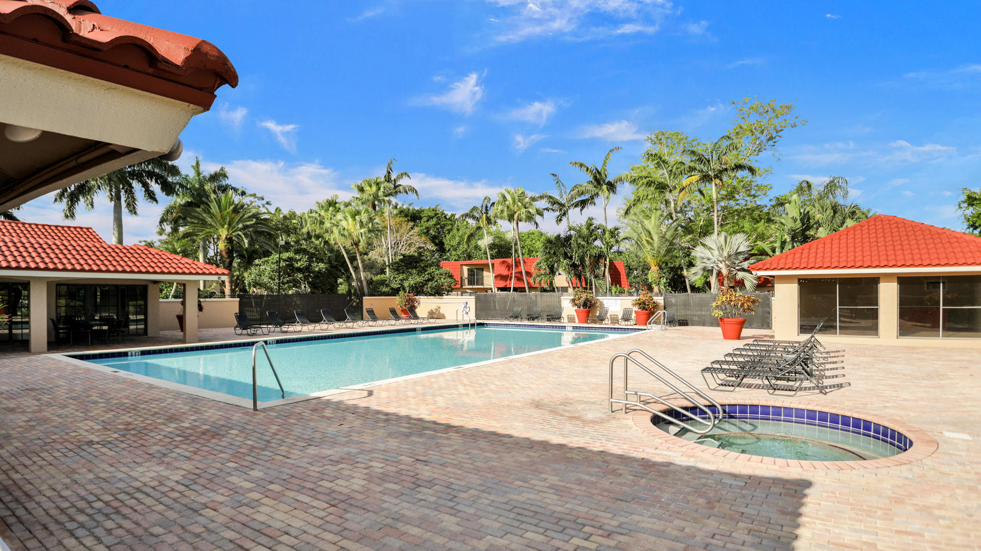 8057 Severn Drive, Unit A Boca Raton, FL 33433 - Photo 31 of 33 a view of a house with swimming pool and sitting area