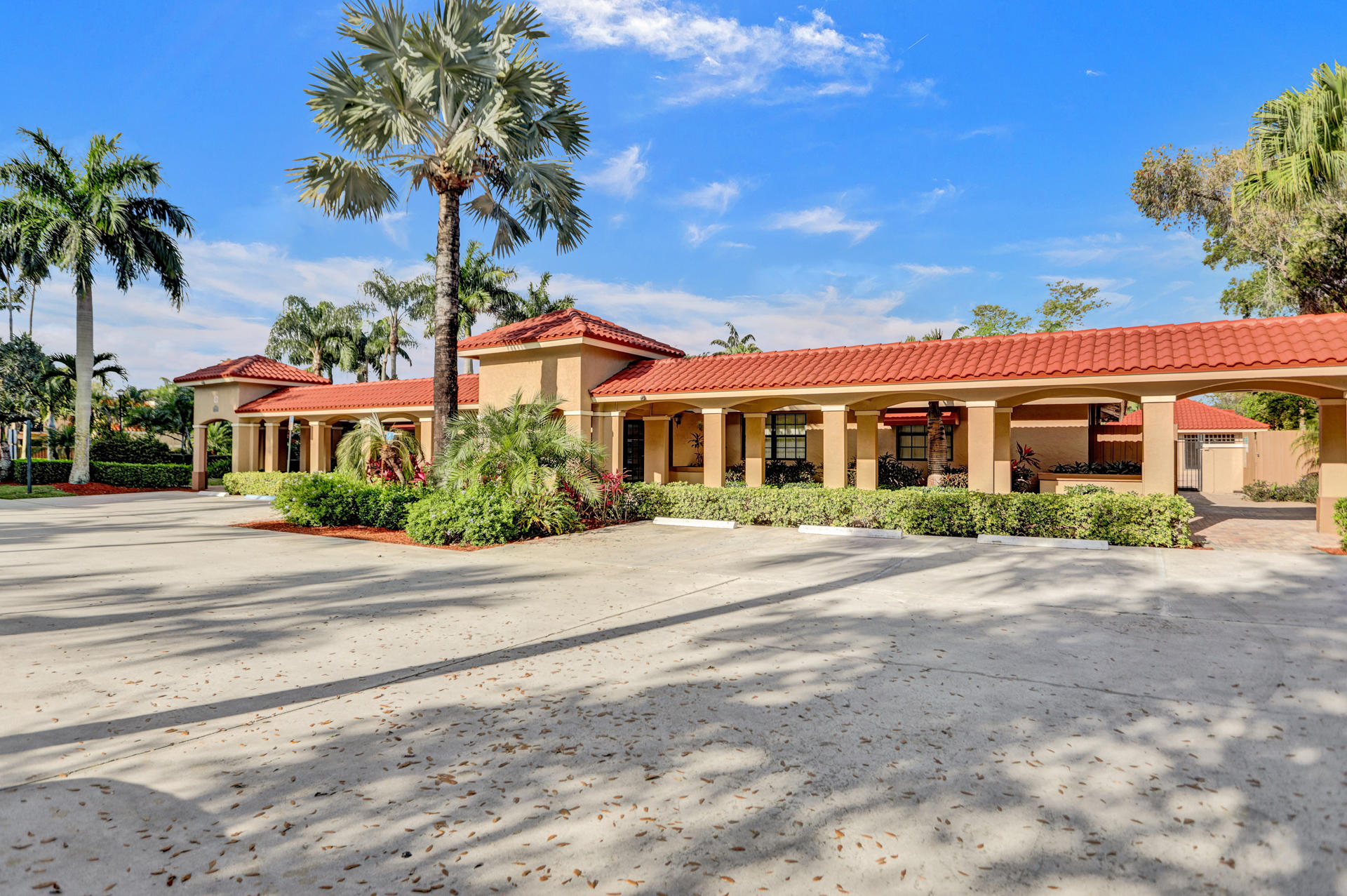 8057 Severn Drive, Unit A Boca Raton, FL 33433 - Photo 32 of 33 front view of a house with a yard
