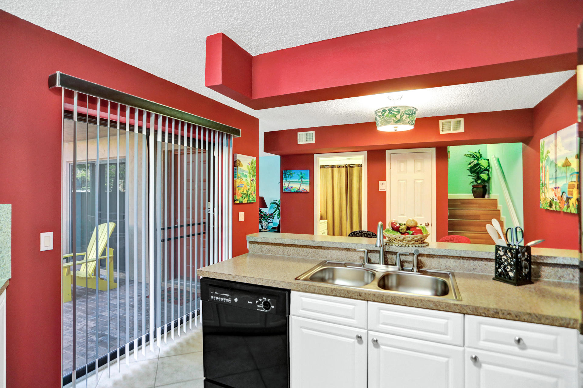 8057 Severn Drive, Unit A Boca Raton, FL 33433 - Photo 8 of 33 a kitchen with a sink and a large window