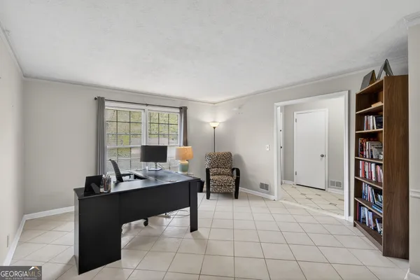 a view of workspace with furniture and cabinet