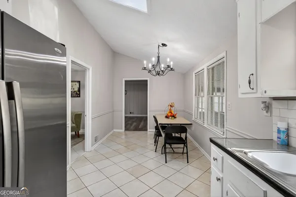 a kitchen with stainless steel appliances a sink and cabinets
