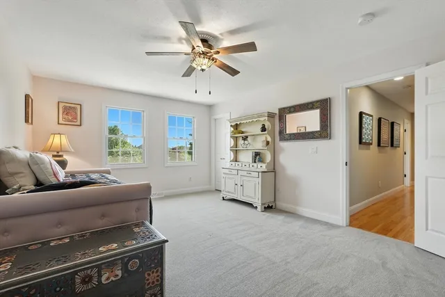 a bedroom with a bed and dresser