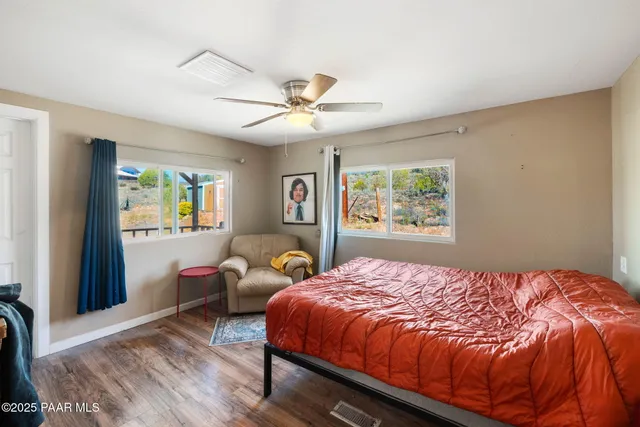 a bedroom with a large bed and a window