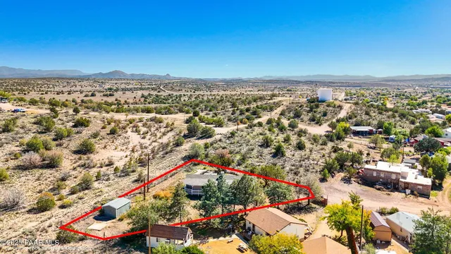 an aerial view of residential building and trees