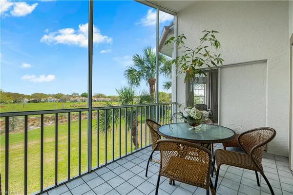 a view of a chairs and table in patio