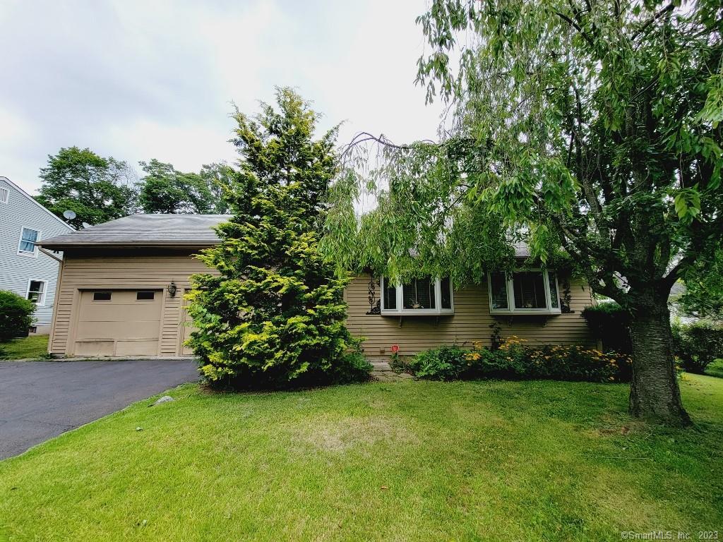 325 Ridge Road Hamden, CT 06517 - Photo 1 of 1 a front view of a house with garden