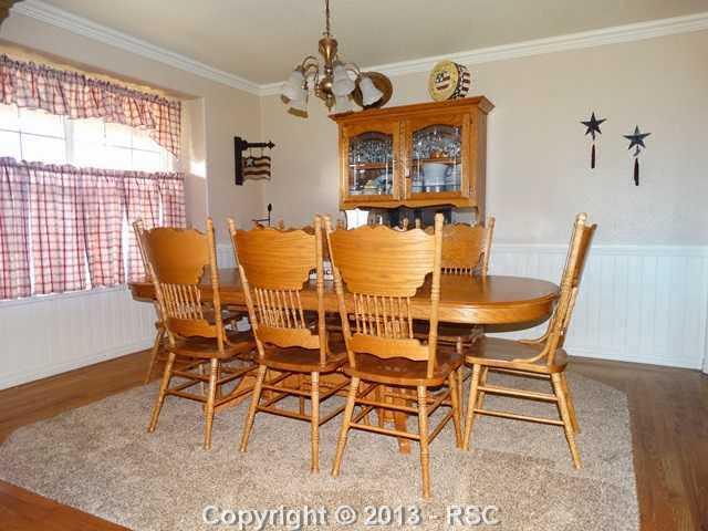 9065 Rutledge Drive Colorado Springs, CO 80920 - Photo 8 of 25 Formal dining room perfect for entertaining.
