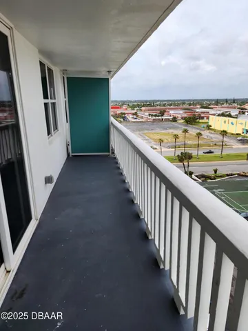 a view of swimming pool with outdoor seating and city view
